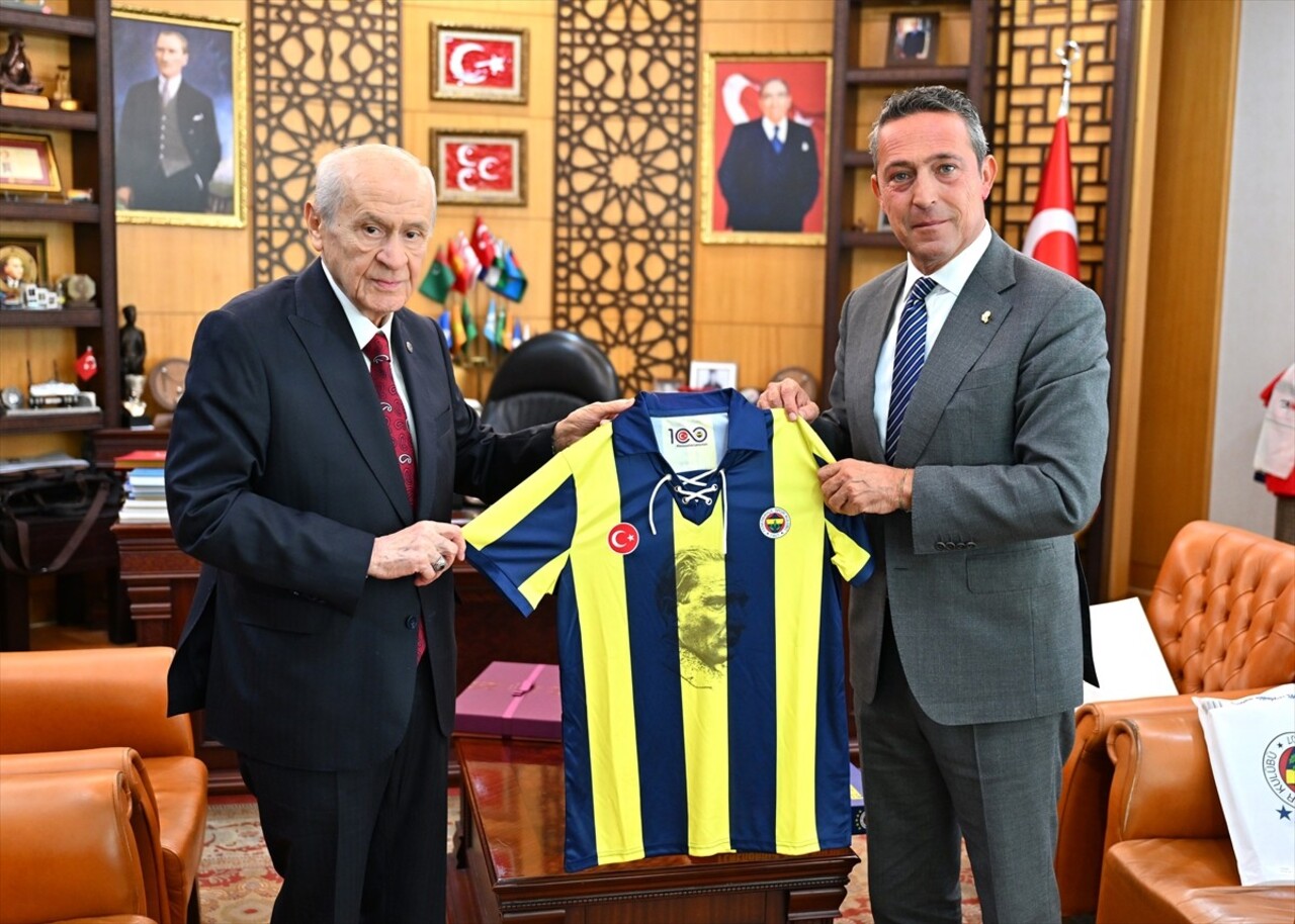 MHP Genel Başkanı Devlet Bahçeli (sağda), Fenerbahçe Spor Kulübü Başkanı Ali Koç (solda) ile...