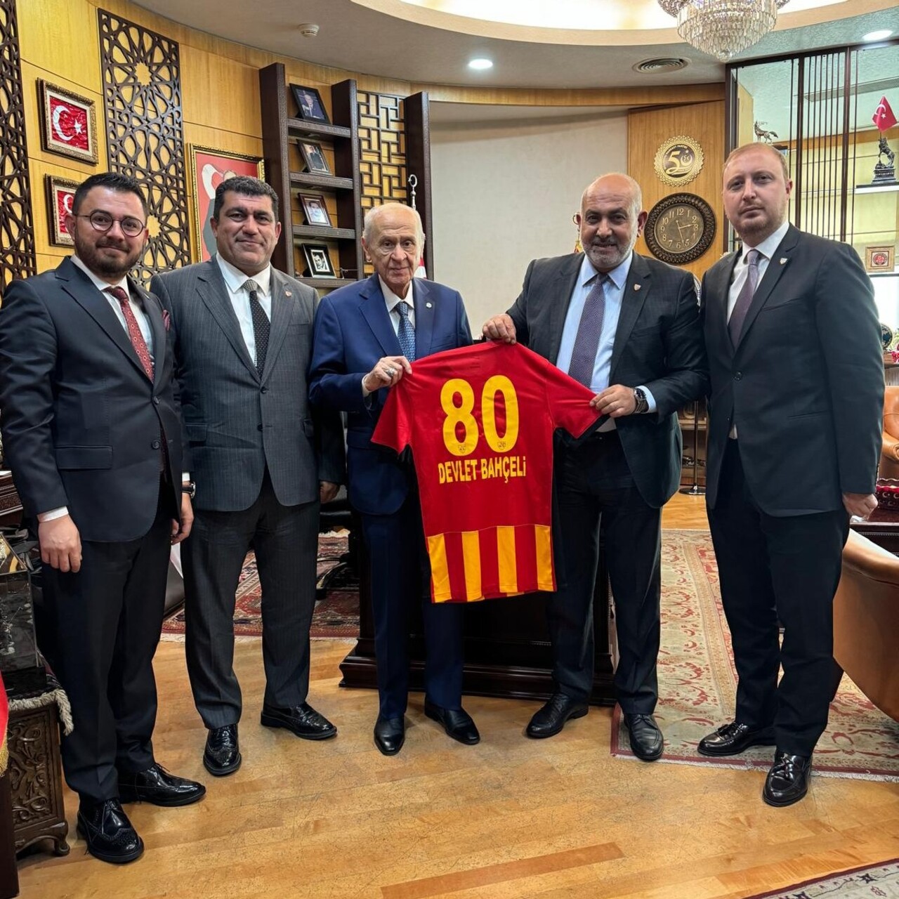 MHP Genel Başkanı Devlet Bahçeli (ortada), Bellona Kayserispor Başkanı Ali Çamlı (sağ 2) ve...